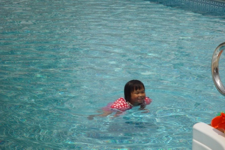 Kasen swimming with floaties